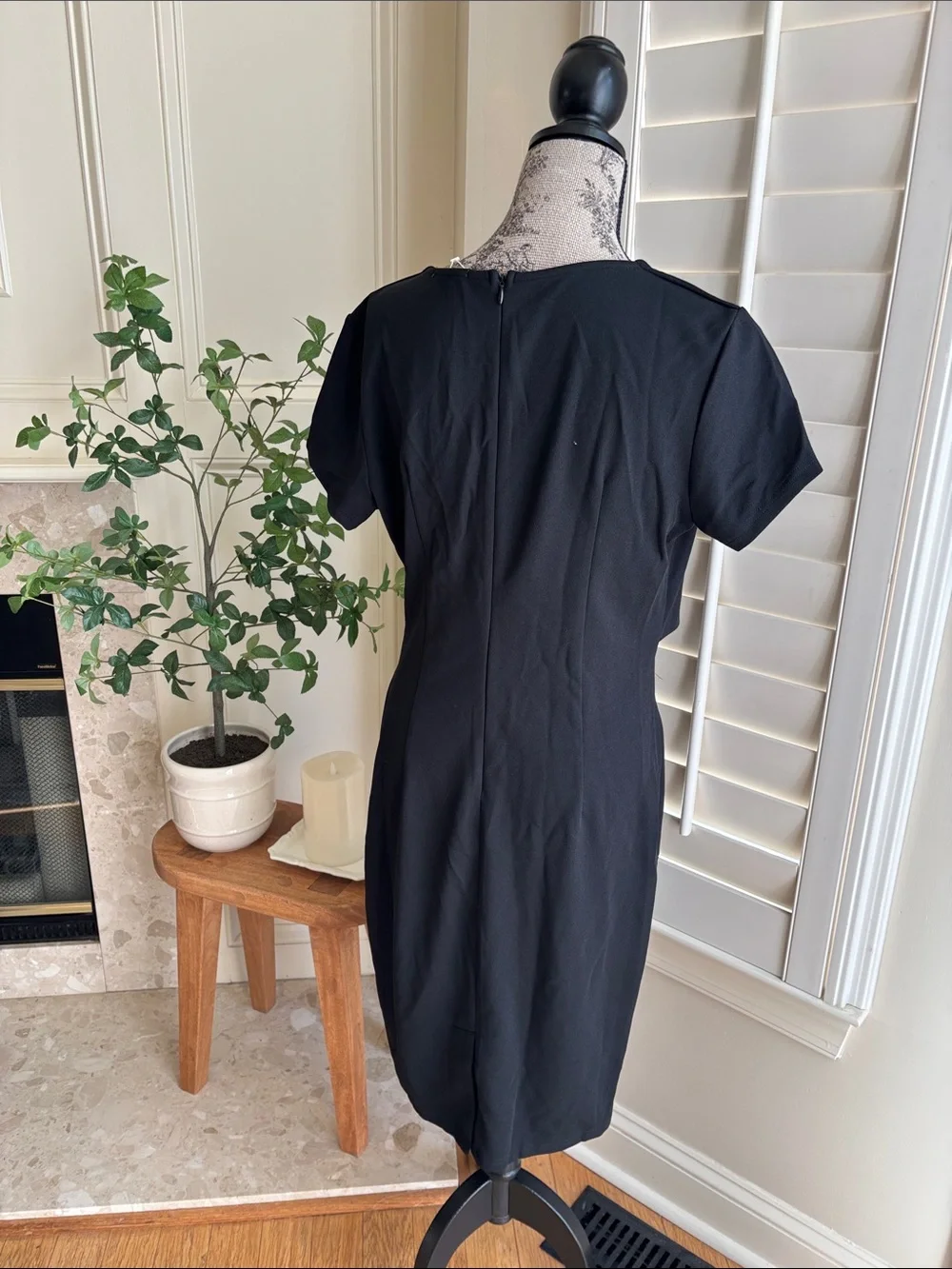 classic black short-sleeve faux-wrap midi dress featuring a draped surplice